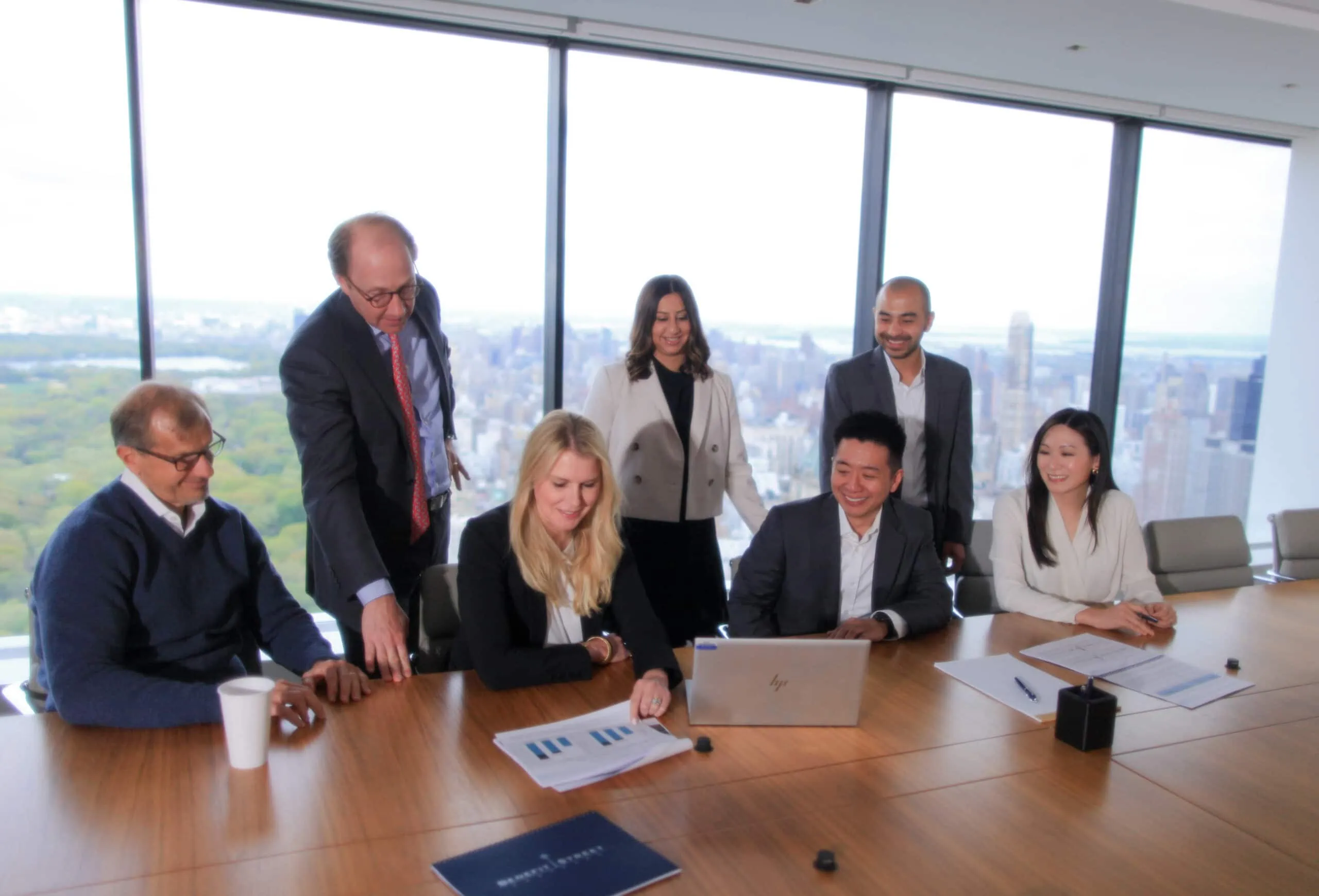 several people sitting around a boardroom table