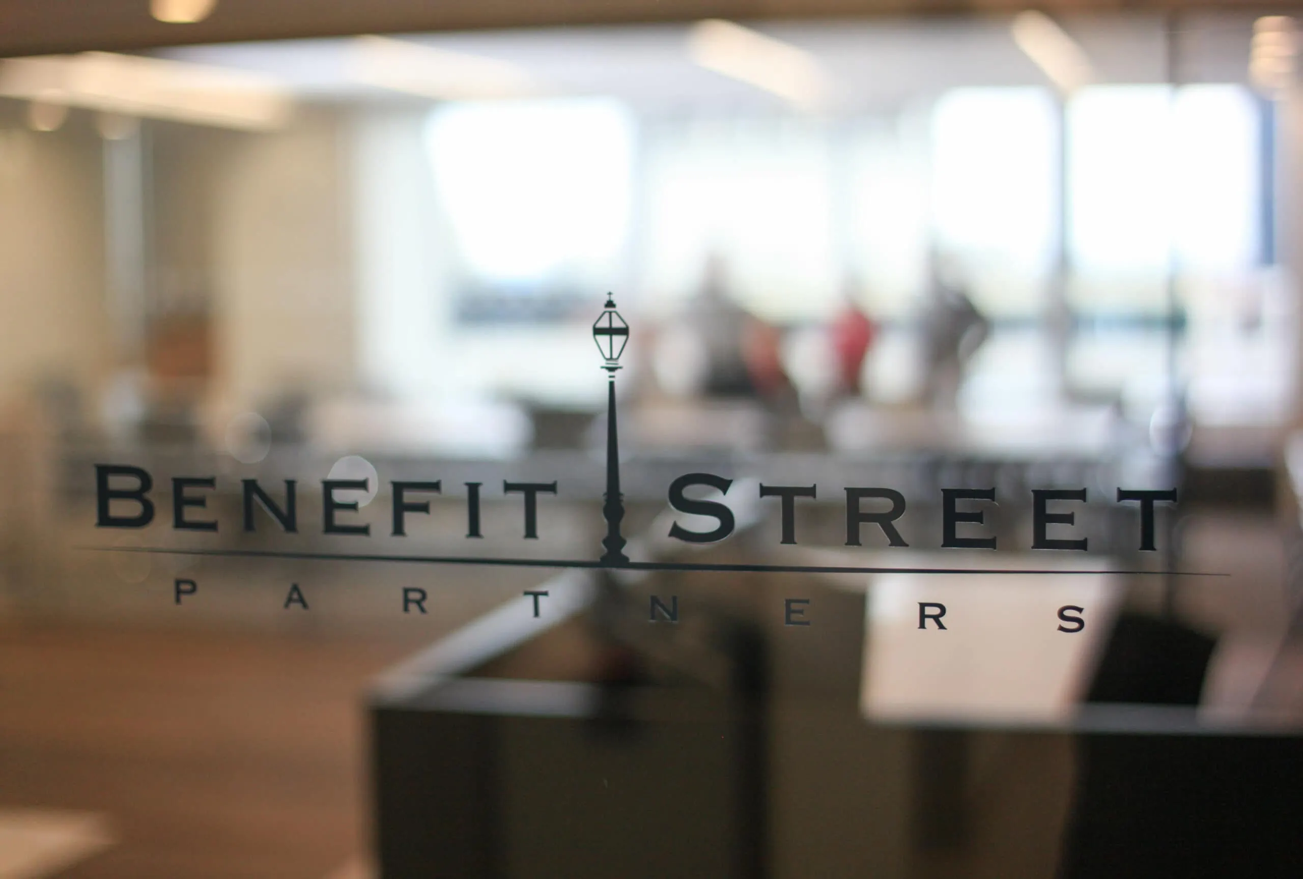 benefit street partners logo with blurred background